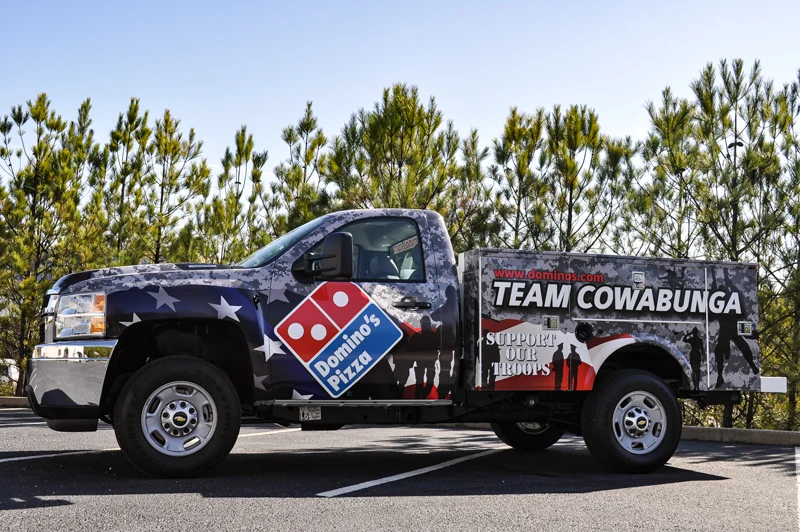 Team Cowabunga truck wrapped with Domino's branding